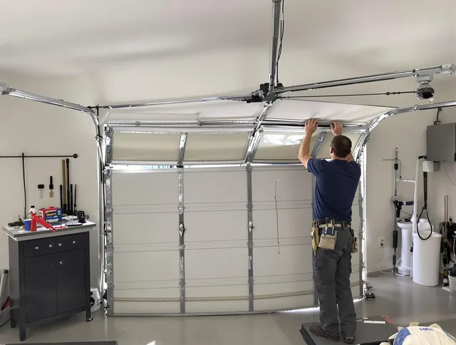 Euclid Garage Door Repair specialist performing precise section replacement on Euclid garage door